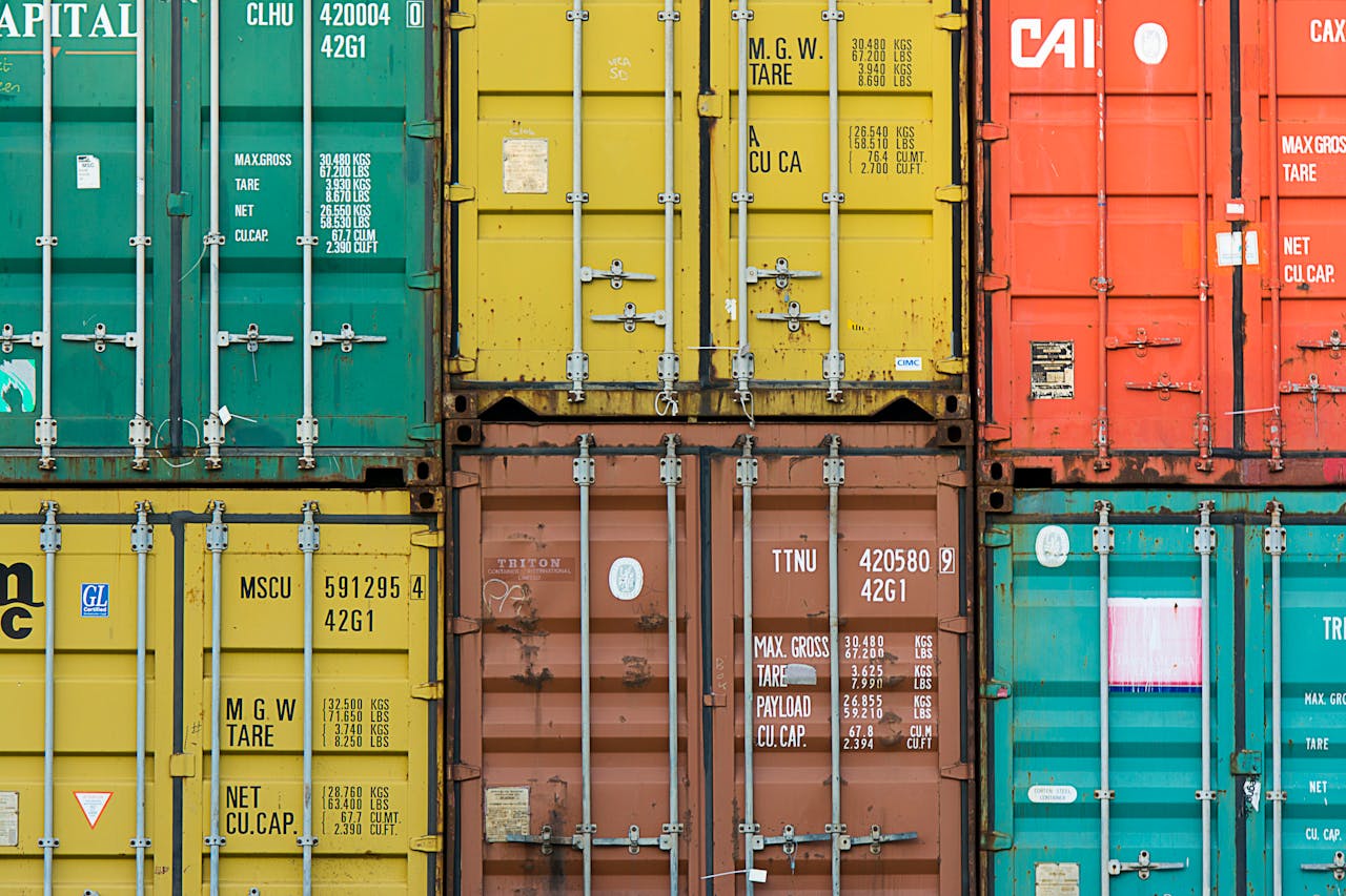 Vibrant cargo containers stacked in a shipping yard highlighting global trade.